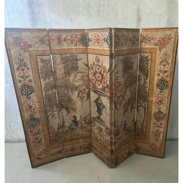 A Swedish five-panel folding screen assembled in the 20th century using five painted canvas panels dating to the 18th...