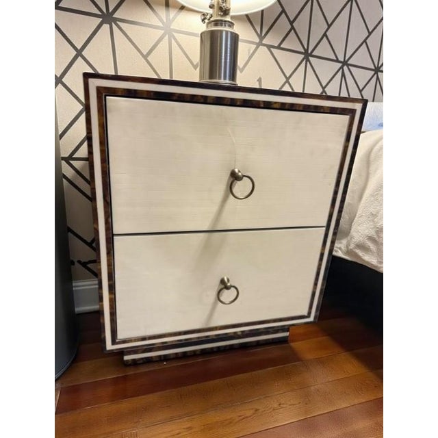 Bold architectural presence defines this vintage two-drawer stand, crafted in richly figured burled walnut with striking...