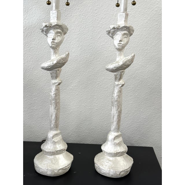 A great pair of plaster after the “Tete de Femme” lamps designed by Giacometti for Syrie Maugham in the 1930’s. These...