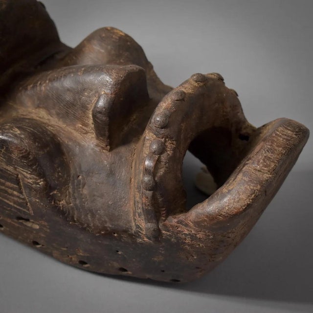 This is a very old and well-used Dan mask, originating from the Dan people of Liberia, CÃ´te d'Ivoire, and Guinea, are...