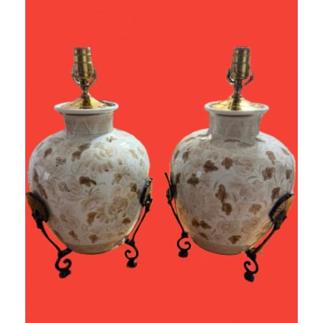 A pair of hand painted vintage ginger jars lamps by Maitland-Smith a classic chinoiserie style. They are a off - white...