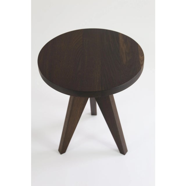 This Lollipop side table is handmade using dark brown smoked European oak. The surface is oiled. Alternative colors are...