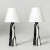 Striking pair of stoneware table lamps by Carl-Harry Stålhane. Graphical, sculptural design with striking black and white...