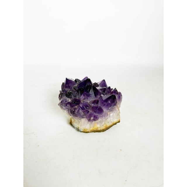 Amethyst paperweight, France, 20th century, a natural piece of raw and elegant beauty. Composed of a cluster of amethyst...