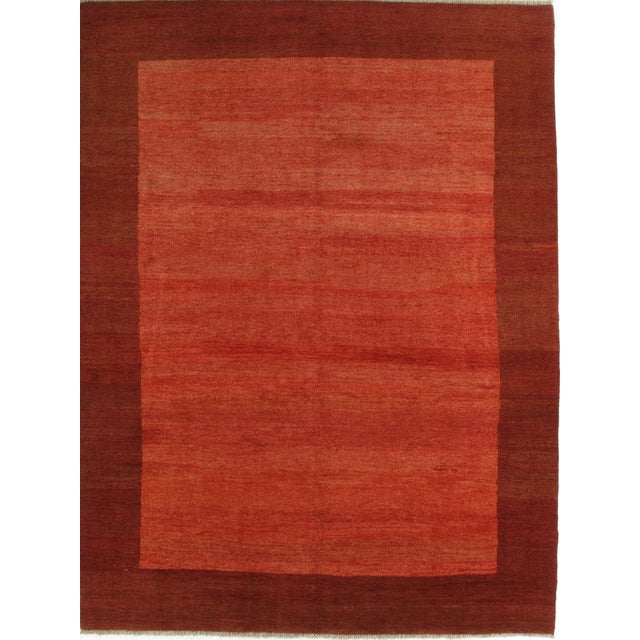 Vintage hand-knotted Persian Gabbeh rug featuring a minimalist field with subtle tonal variation and soft abrash. Gabbeh...