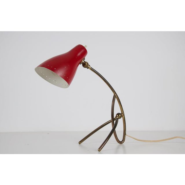 Brass and metal table lamp by giuseppe ostuni, italy, 1960s. This elegant mid-century lamp features a sculptural red metal...