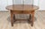 This elegant 20th-century French center table is a beautifully crafted piece that blends functionality with classic French...