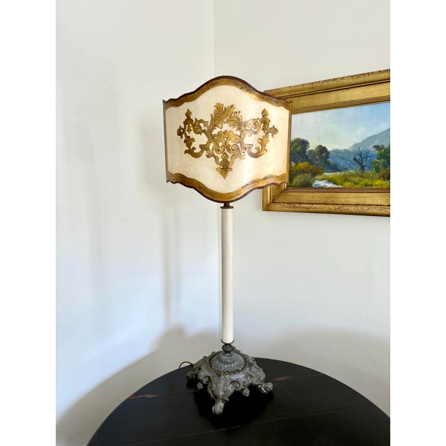 A striking early 20th-century table lamp designed in the form of a traditional altar candlestick. Featuring an ornate cast...