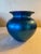 Gorgeous iridescent hand blown blue ribbed art glass vase with iridescent gold rim, marked "LS '95" to indicate Lundberg...