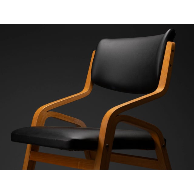 A set of twelve original vintage chairs designed by Ludvík Volák for the Dřevopodnik Holešov factory in Czechoslovakia...