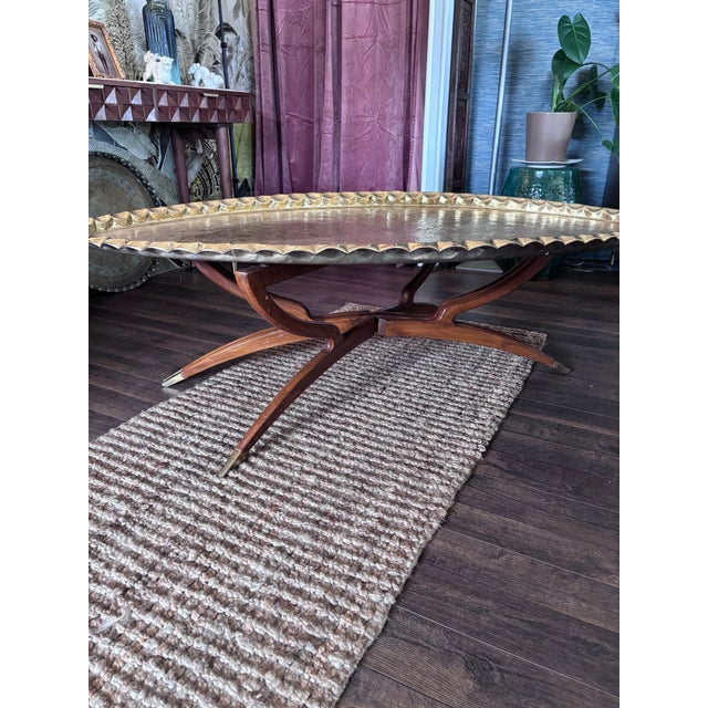 Beautiful Moroccan coffee table in great shape brass table with teak spider legs from Morocco circa 1950