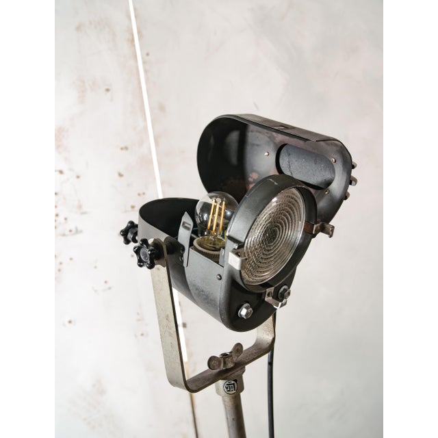 A vintage French theater spotlight by Lita, still standing on the rolling tripod it was originally built with, a genuinely...