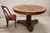 We present an elegant antique Italian round table dating back to the early 19th century. The table features typical...