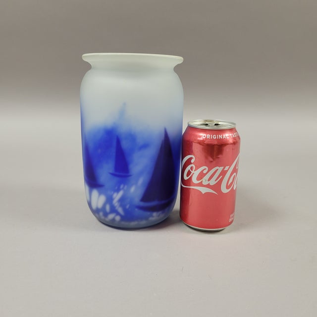 A stunning royal blue and white art glass vase with matte finish featuring images of sailboats. Made by Norwegian artist...