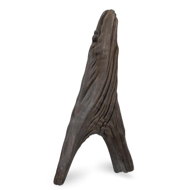 In Rooted Flow, Roland Berger works with a found piece of driftwood, accentuating its organic form. The sculpture appears...