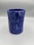 This striking studio art pottery vessel features a rich cobalt blue glaze with a hand-incised open-book design across the...