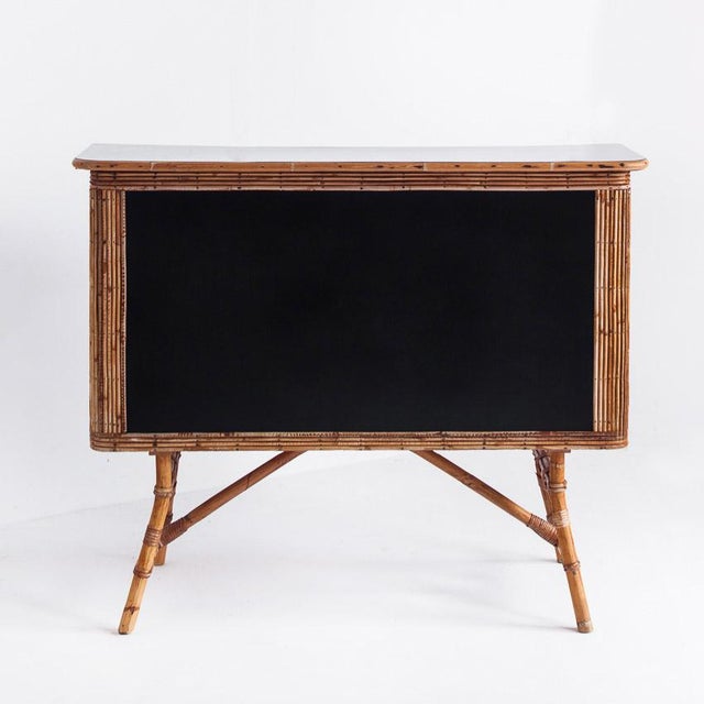 The front part had a vinyl with an old-fashioned illustration and it has been painted with black paint.