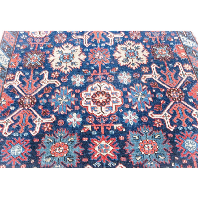 This striking antique Karabagh rug, handwoven in the Caucasus, showcases the rich artistic heritage of 19th-century...