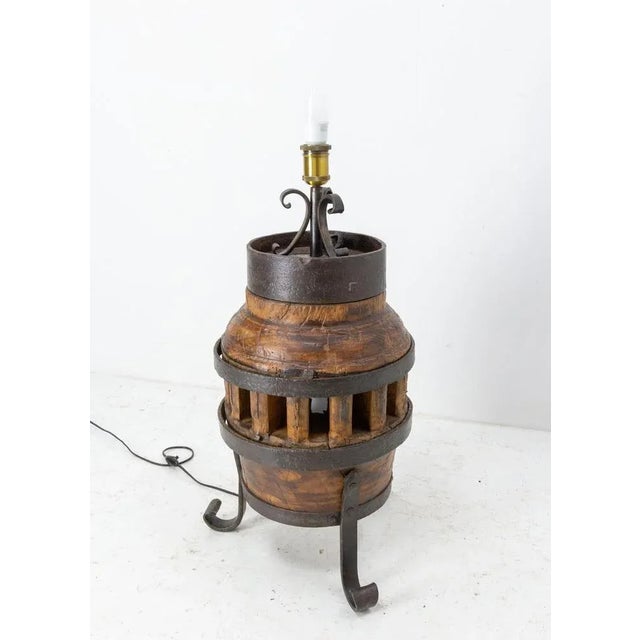 Hub table lamp made with a part of an old wheel Elm and wrought iron French circa 1960 Good condition This can be re-wired...