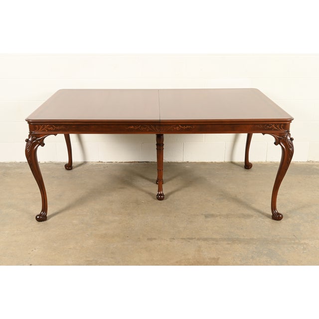 An exceptional Georgian, Chippendale, or Queen Anne style extension dining table In the manner of Romweber By Orinoco...