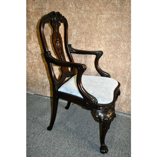 Vintage Ornate Chair has a Queen Anne Georgian Style. Ornate. Carved Mahogany. Paw Feet. Shell Motif. The finish is a very...