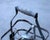 Antique bottle carrier with wooden handle. Holds 4 bottles of wine.