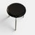 Early three-legged stool designed by arne jacobsen and produced by fritz hansen in denmark. executed with a black...