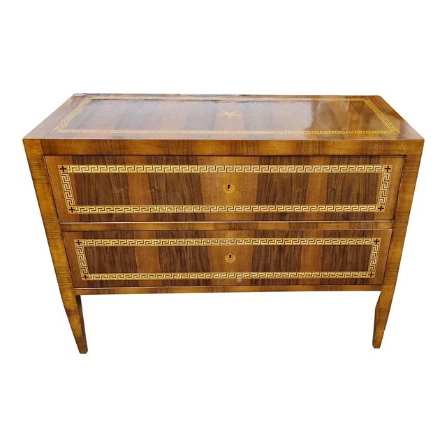 Louis XVI style chest of drawers, supported by truncated pyramidal feet. It has two veneered drawers with geometric maple...