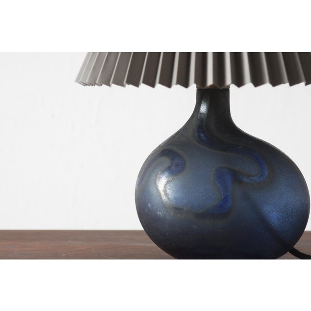 A unique Danish table lamp designed by Michael Bang for Holmegaard, representing the Mid-Century Modern style...