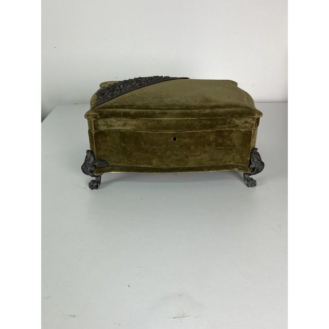 A charming French jewelry box from the 1940s. Upholstered in green velvet. Pewter corner fittings, some cracks but...