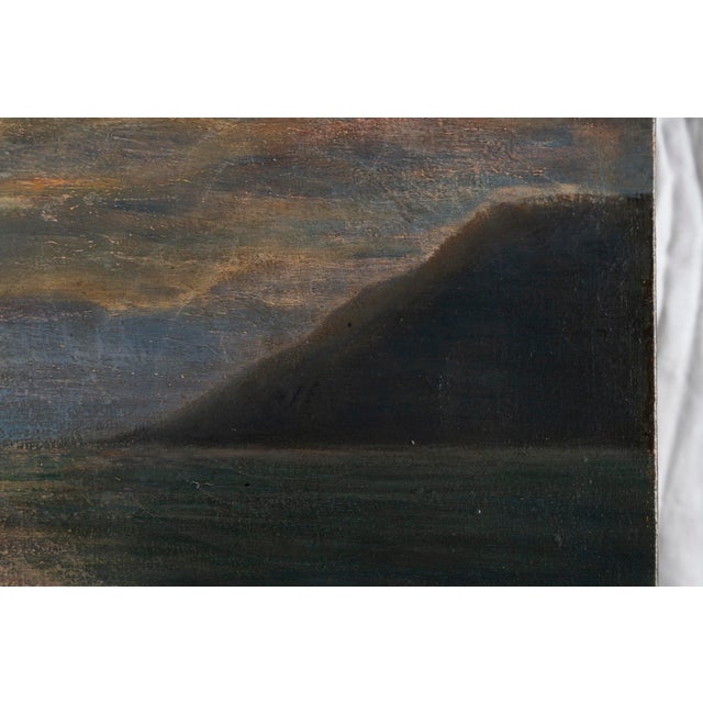 Signed "G. Goldberg" This atmospheric seascape captures a tranquil coastal scene at sunset, where the fading light...