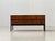 The body is finished in a warm, finely grained teak veneer, whose vibrant grain lends the front and top a calm, elegant...