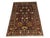 Rich burgundy sets the backdrop for a Persian-style floral design of scrolling vines, blossoms, and paisley-like motifs....