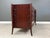 A mid century modern large teak twelve drawer dresser with sculpted pulls and beautifully crafted exoskeleton legs in the...