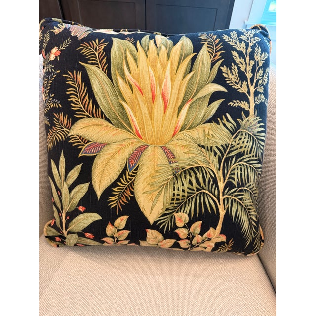 A dramatic pair of custom accent pillows in a richly detailed tropical botanical print featuring oversized protea-style...