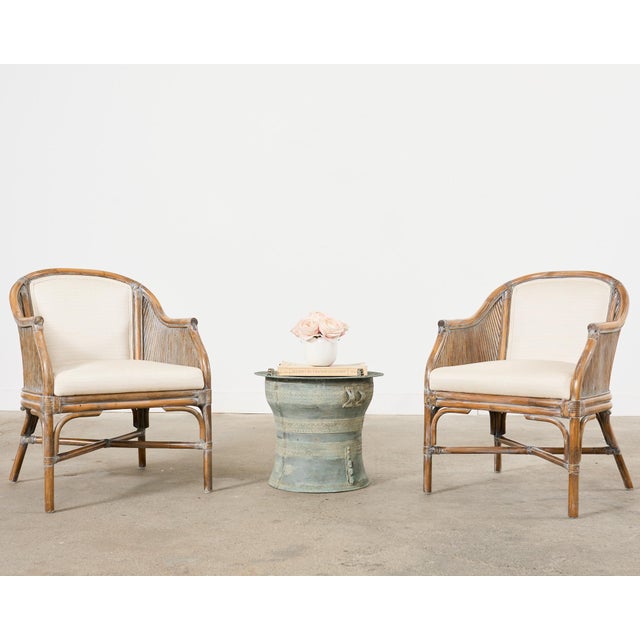Gorgeous pair of organic modern rattan bamboo barrel form armchairs made in the California coastal manner and style of...
