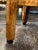 This sturdy mid-century side table has one shelf, perfect for books or a small basket. The feet of the table are square...