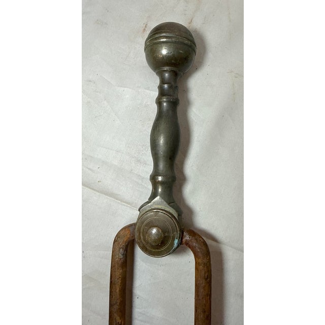 Up for sale is a pair of rare antique 18th century wrought iron and brass English fireplace tongs. The arms are wrought by...
