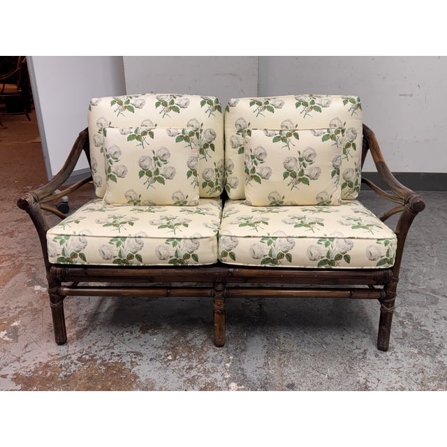 Design Plus Gallery presents a Circa 1970's Bamboo Loveseat from McGuire Furniture. The vintage sofa displays the maker’s...