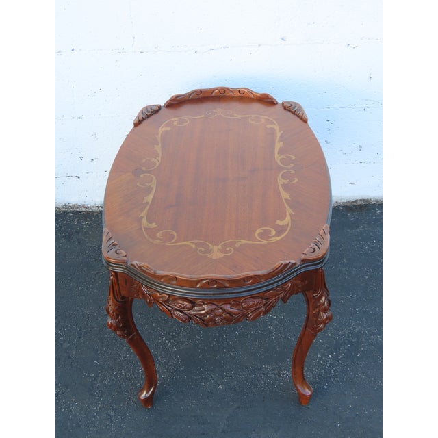 This Coffee Table is made out of wood, solid wood, walnut, and veneer. It has French style and design, it was made in the...