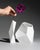 A complementary pair of matte white bisque porcelain vases from the Surface collection, designed by Achim Haigis for...