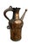 This striking antique copper vessel features a sculptural, figural body with a beautifully aged patina developed over...