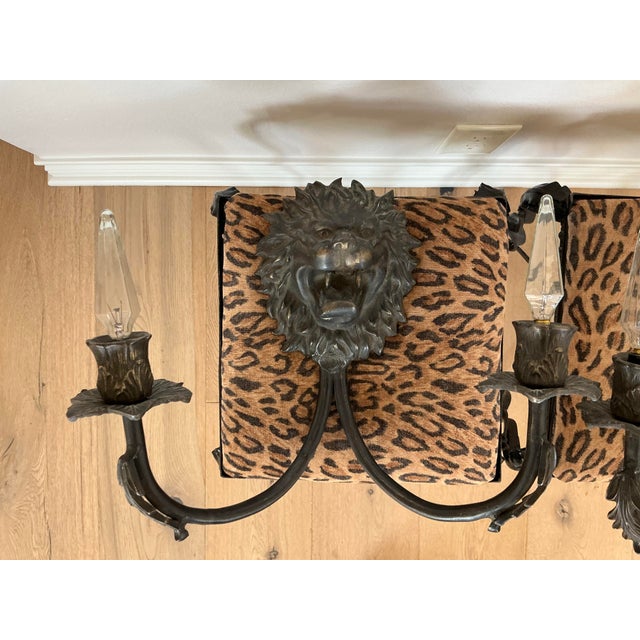 Gorgeous antique iron sconces featuring lion's heads. Substantial, weighty iron construction but ready (and easy) to hang...