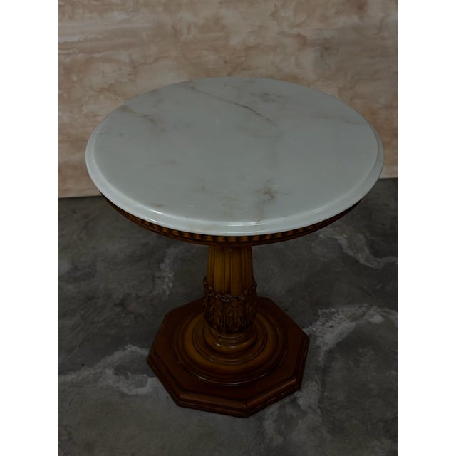 Carrara Marble top round side table. Beautifully carved wooden base. From Italy.