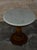 Carrara Marble top round side table. Beautifully carved wooden base. From Italy.