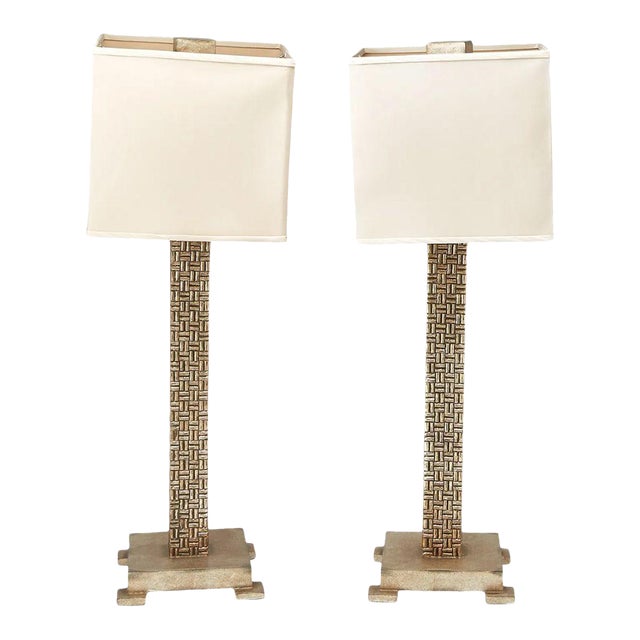 A pair of contemporary silvered geometric column lamps with a refined aesthetic. Each lamp features a tall, rectangular...