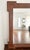 Large wood vintage art deco mirror. The wood frame is vintage. The mirror was replaced in 2014. Can be hung vertically or...