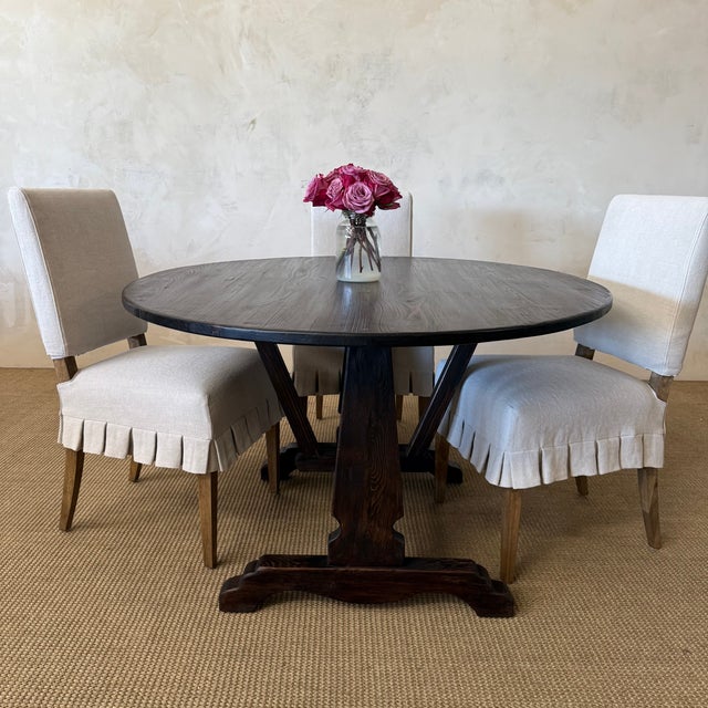 The Lyon Dining Table is crafted from solid pine and finished in a rich, weathered walnut stain, this oval dining table...