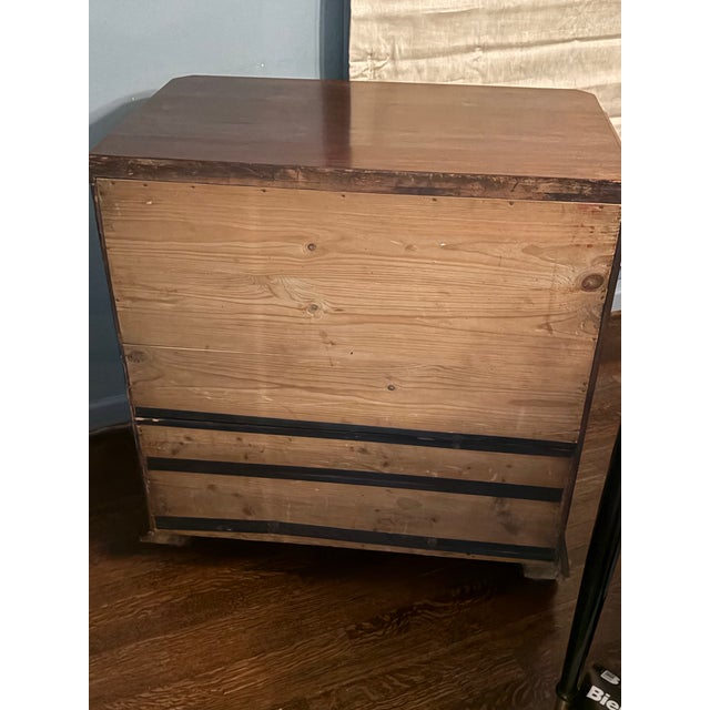 A striking 19th century mahogany chest of drawers showcasing richly figured flame mahogany veneers of exceptional depth...