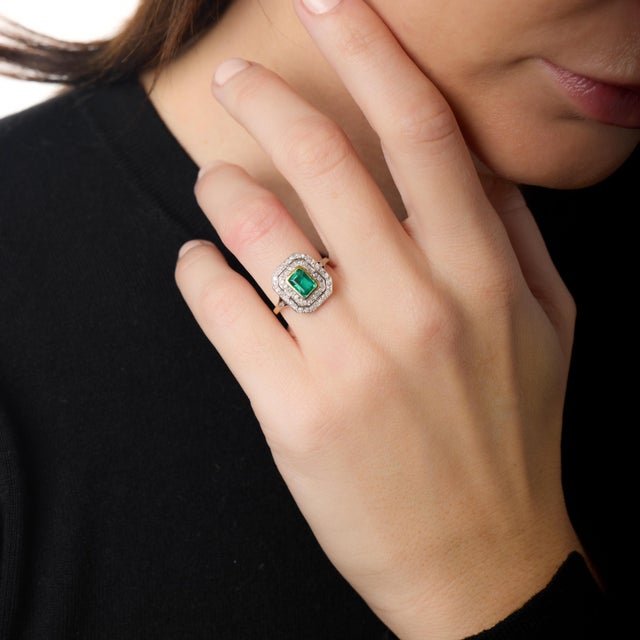 This exquisite Edwardian ring captures the refined romance and delicate craftsmanship of the early 20th century. At its...